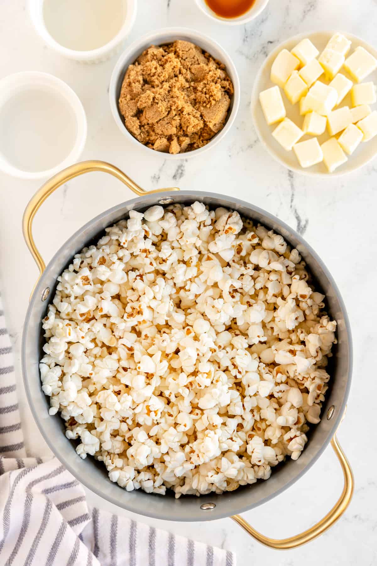 a pot filled with popped popcorn.