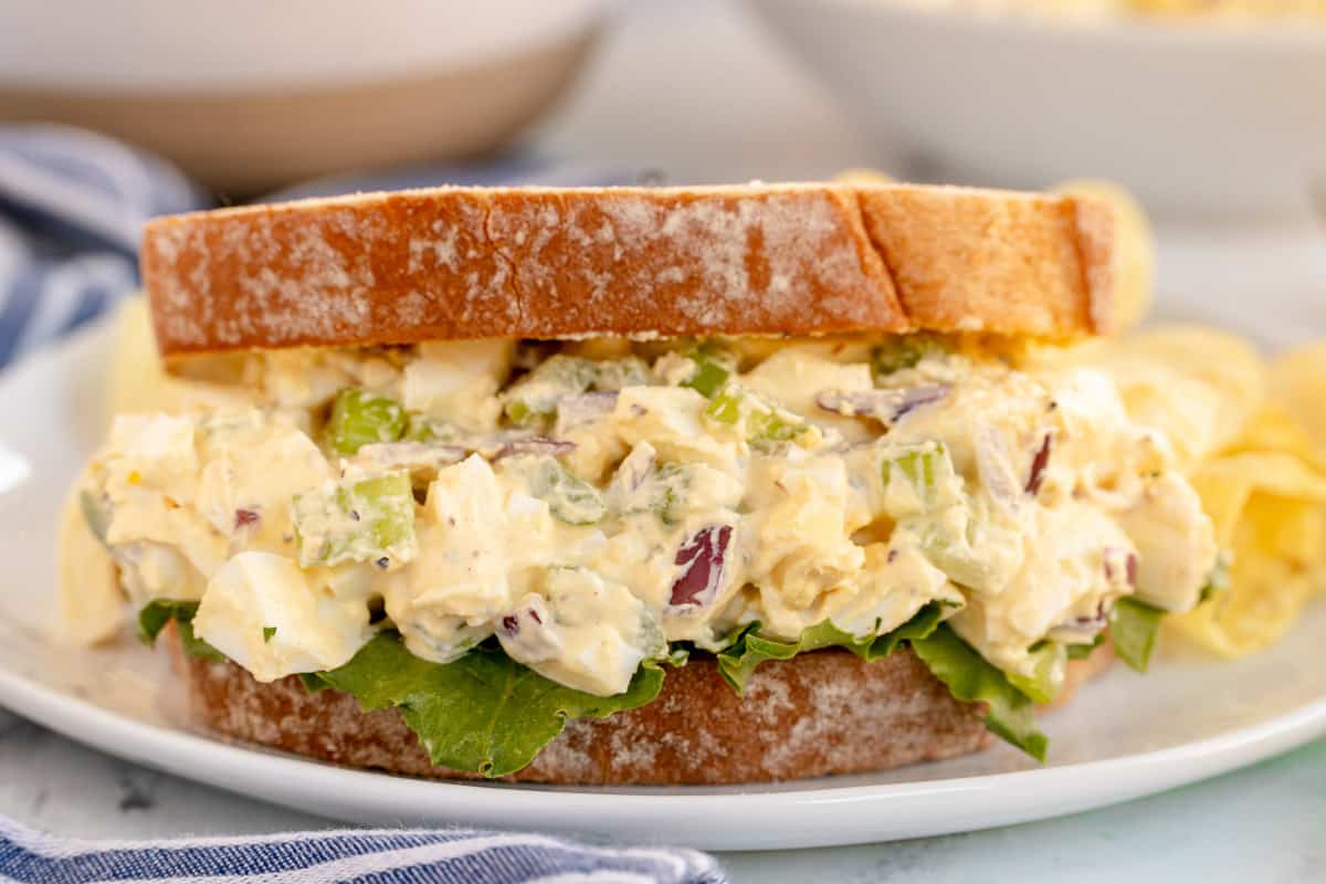 egg salad sandwich on white bread.