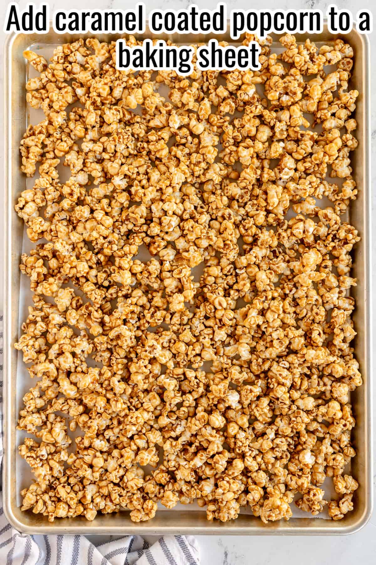 caramel corn spread out on baking sheet, before baking