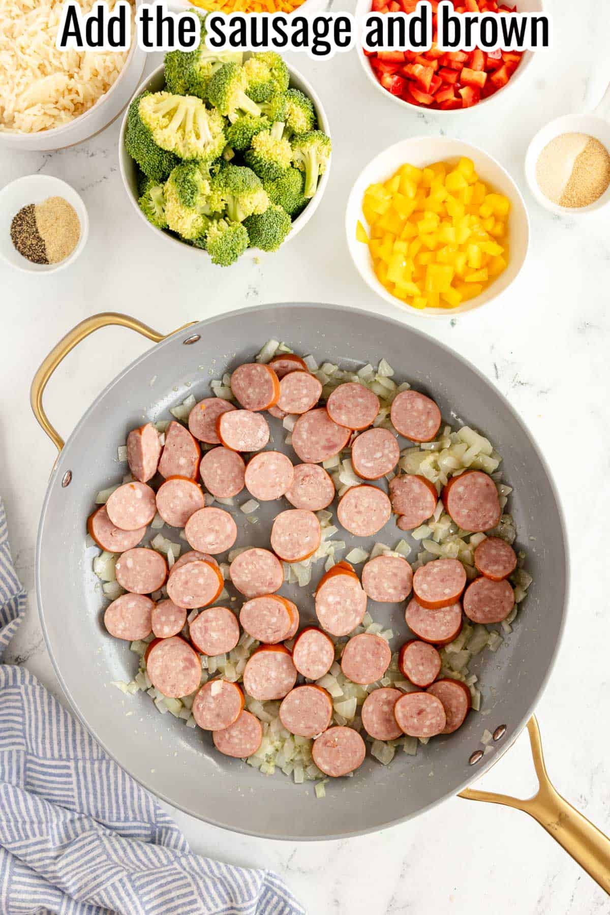 onions, garlic and sliced smoked sausage in a sauté pan.