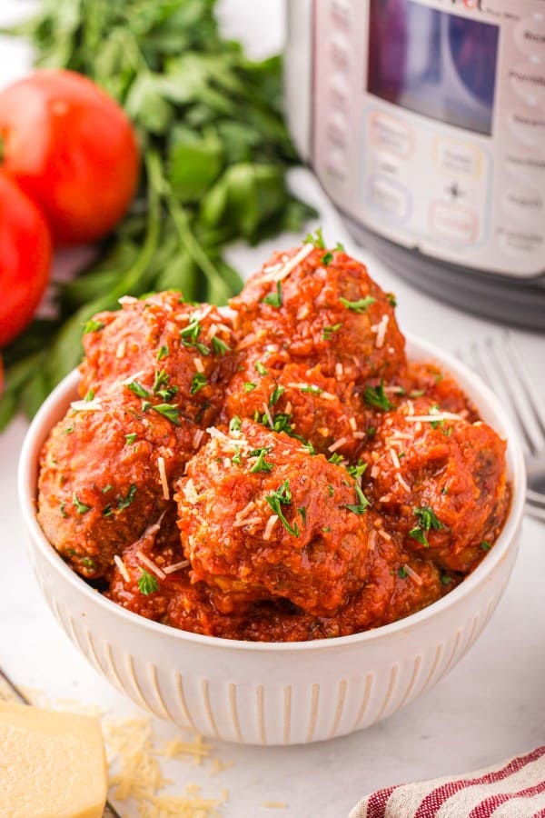 Meatballs in a white bowl.