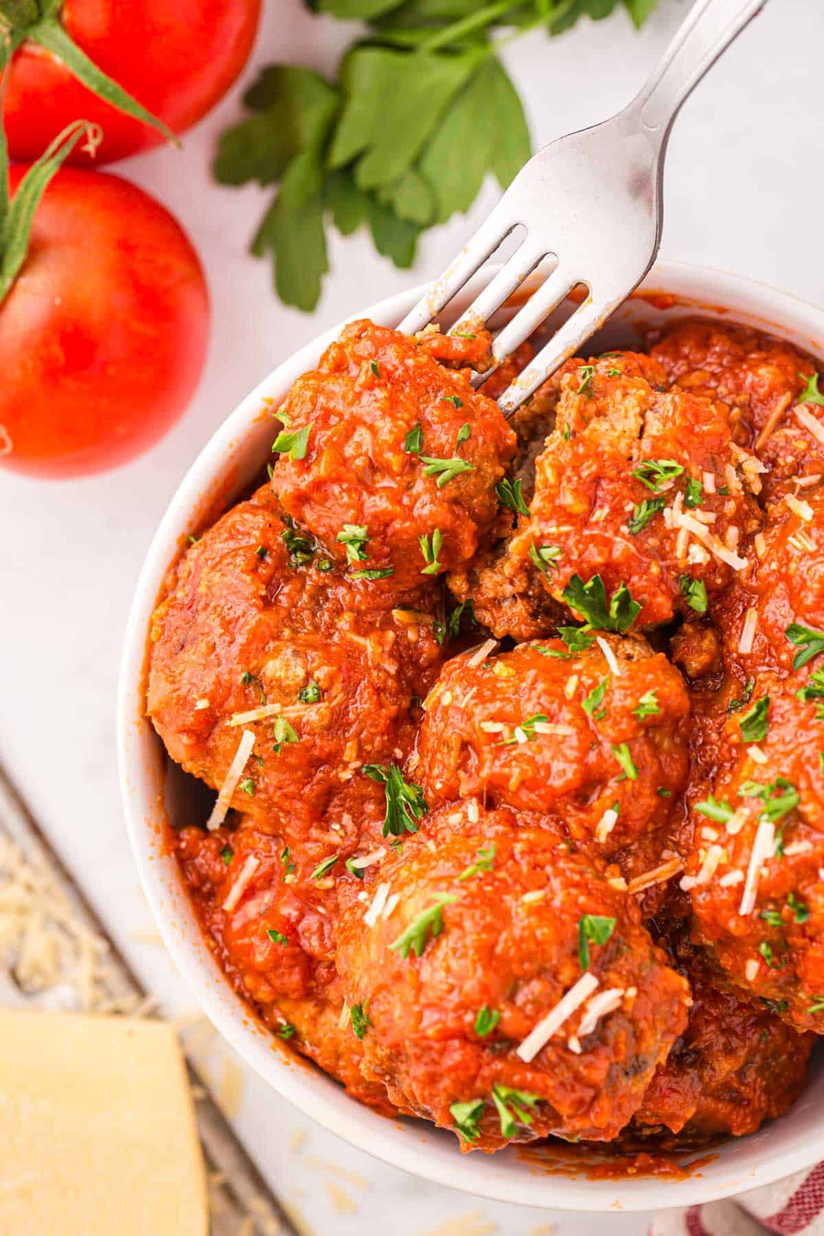 meatballs on a plate with a fork.