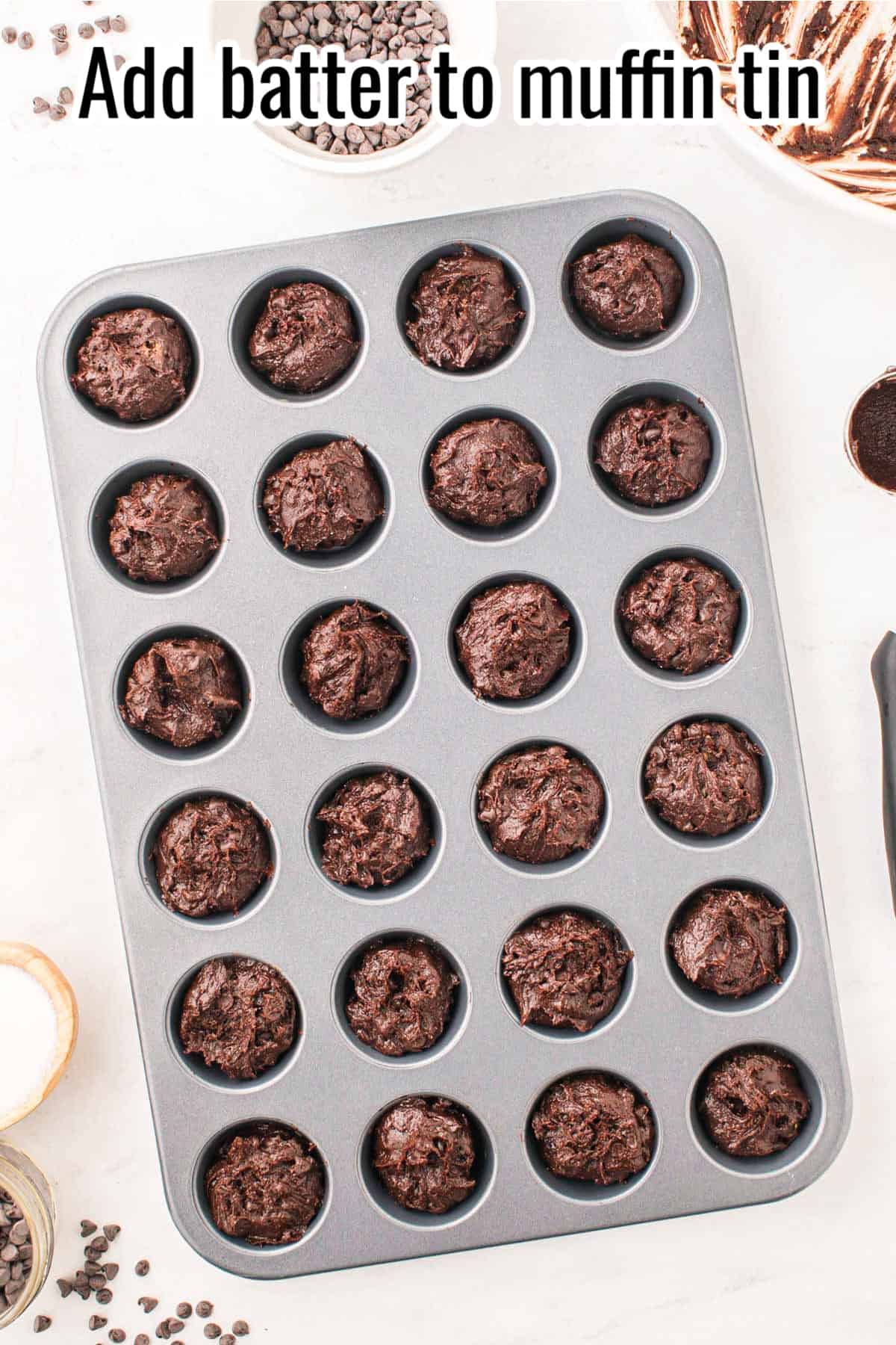 unbaked brownie bites in a muffin tin.