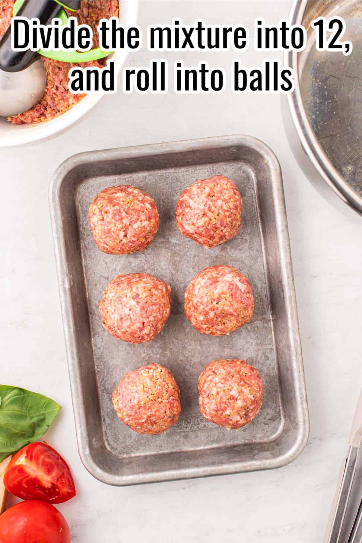 6 meatballs on a tray.