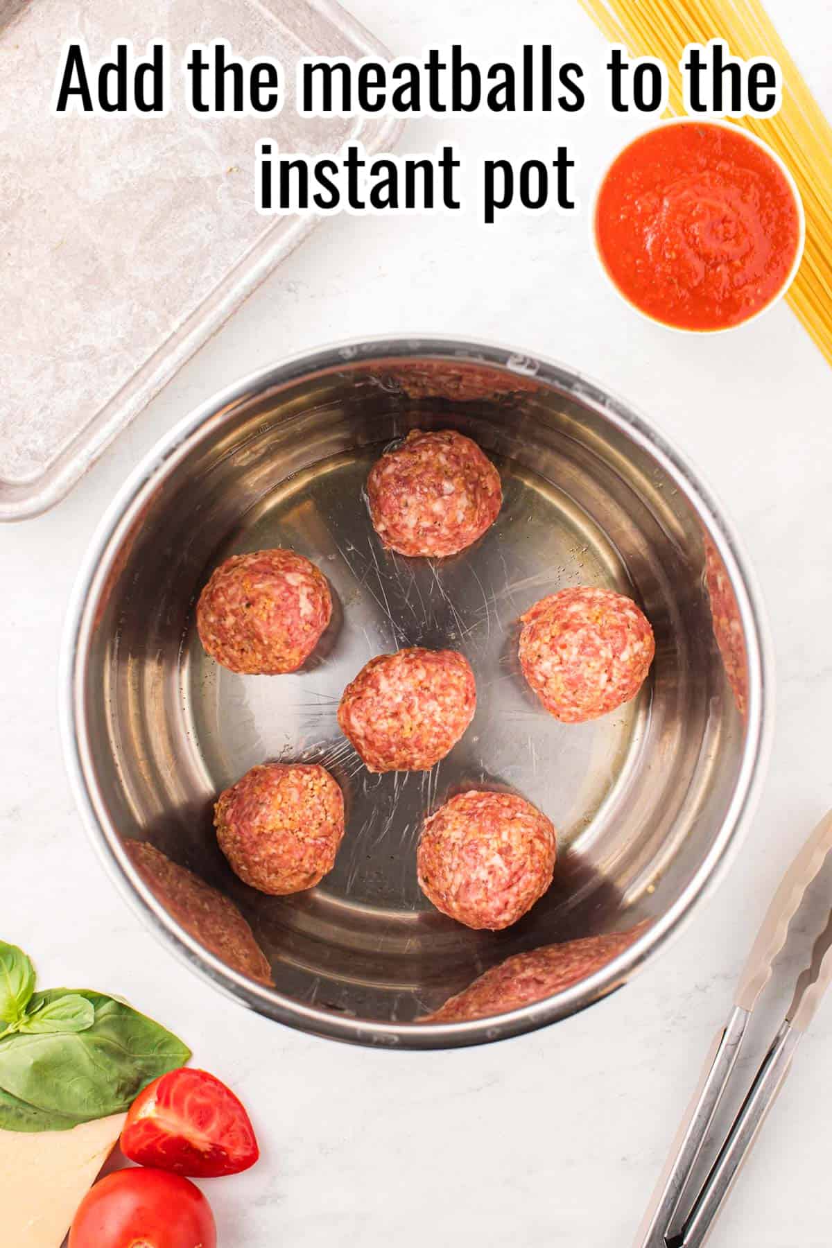 six meatballs in an instant pot, uncooked.
