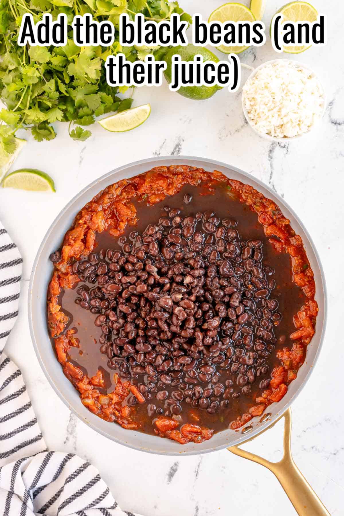 a skillet with tomatoes and black beans.