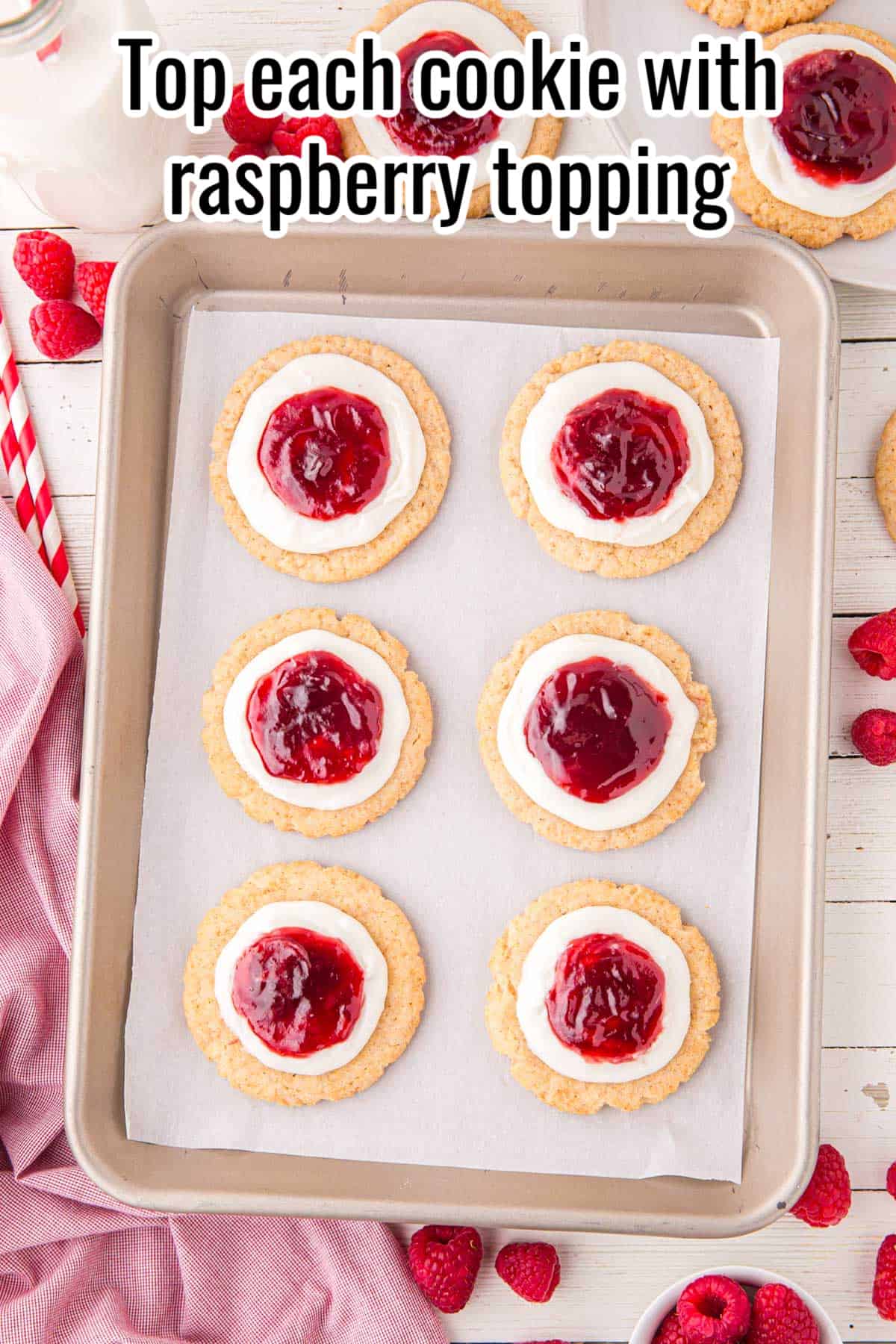 cookies with frosting and raspberry sauce on top.