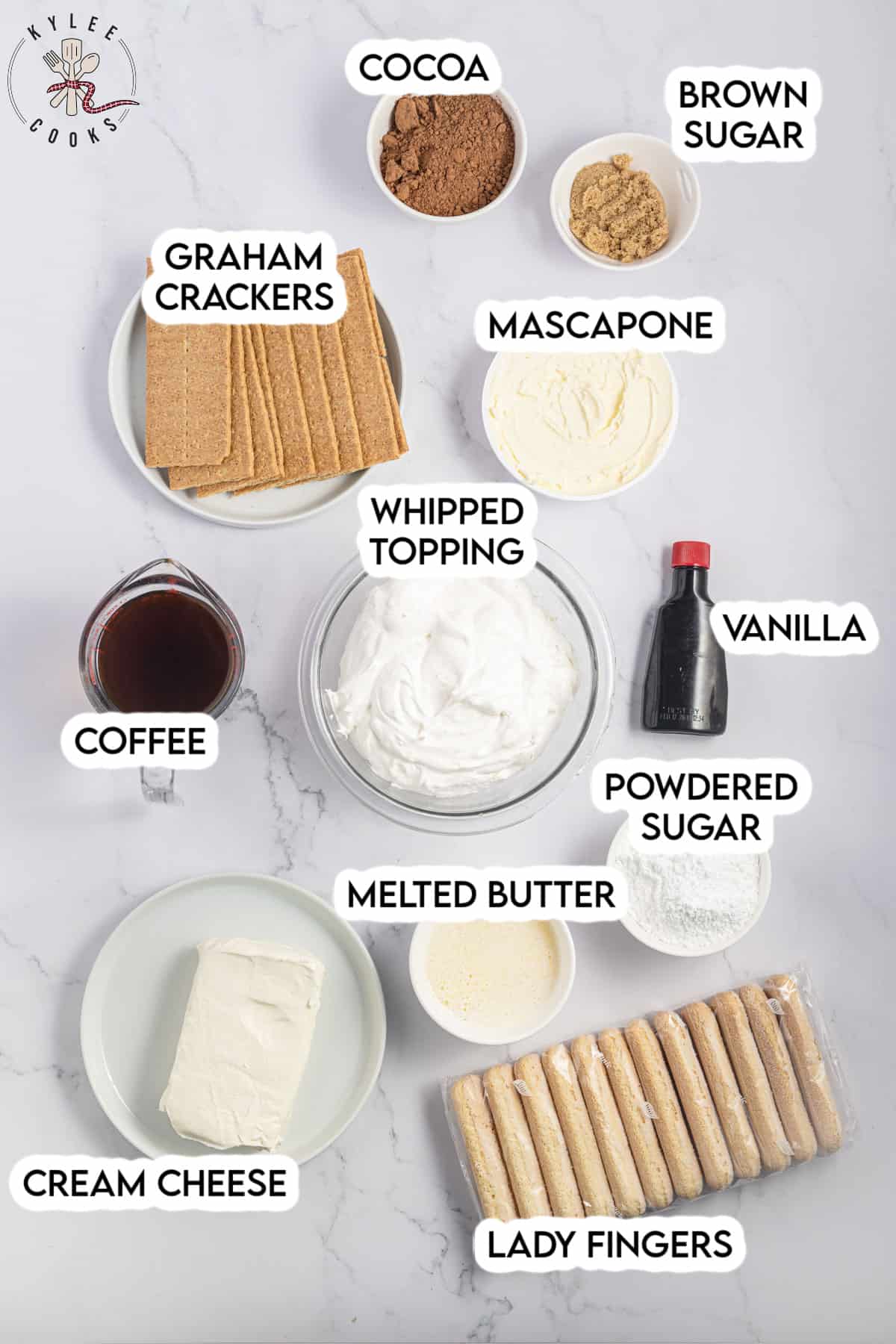 ingredients to make tiramisu cheesecake, laid out and labeled.