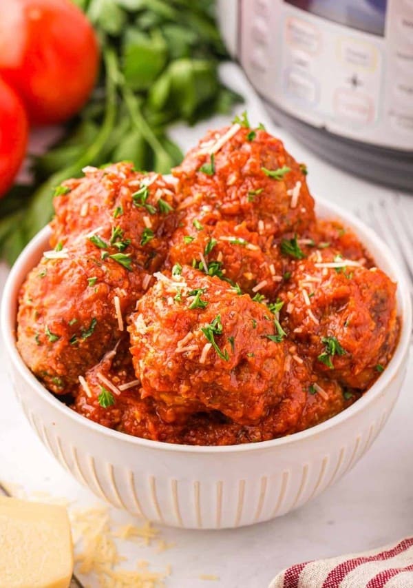 Meatballs in a white bowl.