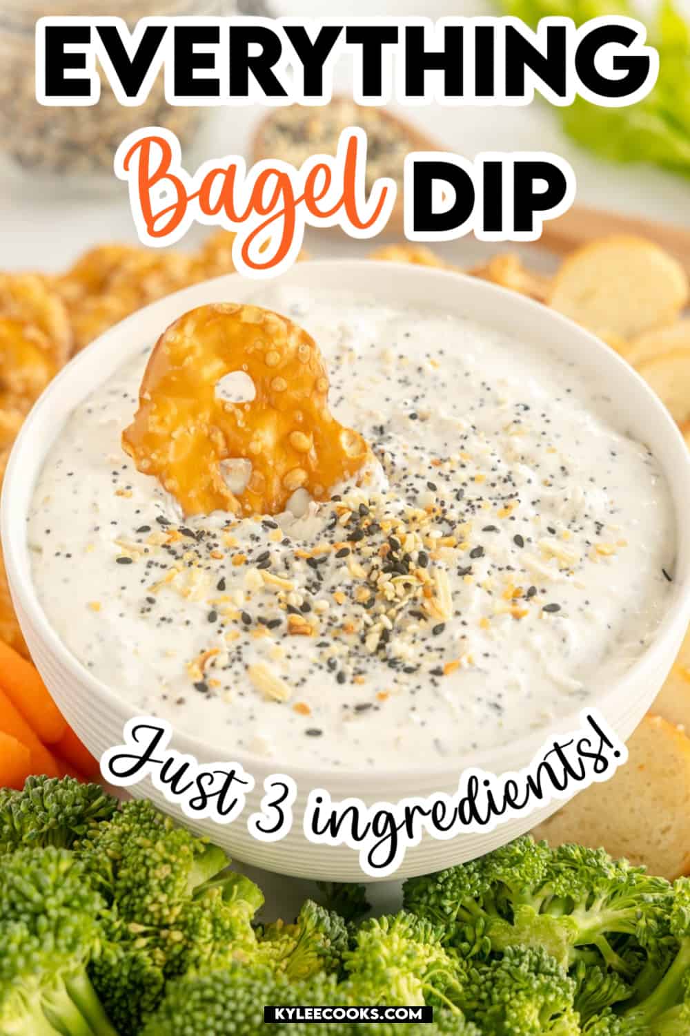 a bowl of everything bagel dip with recipe name and ingredients overlaid in text.
