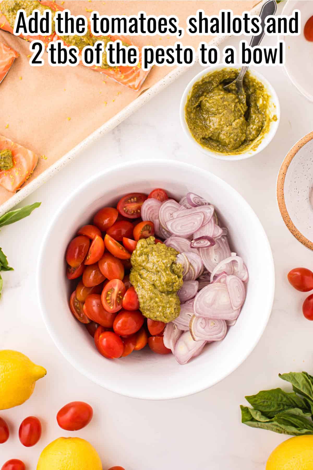 tomatoes, shallots and pesto in a bowl.