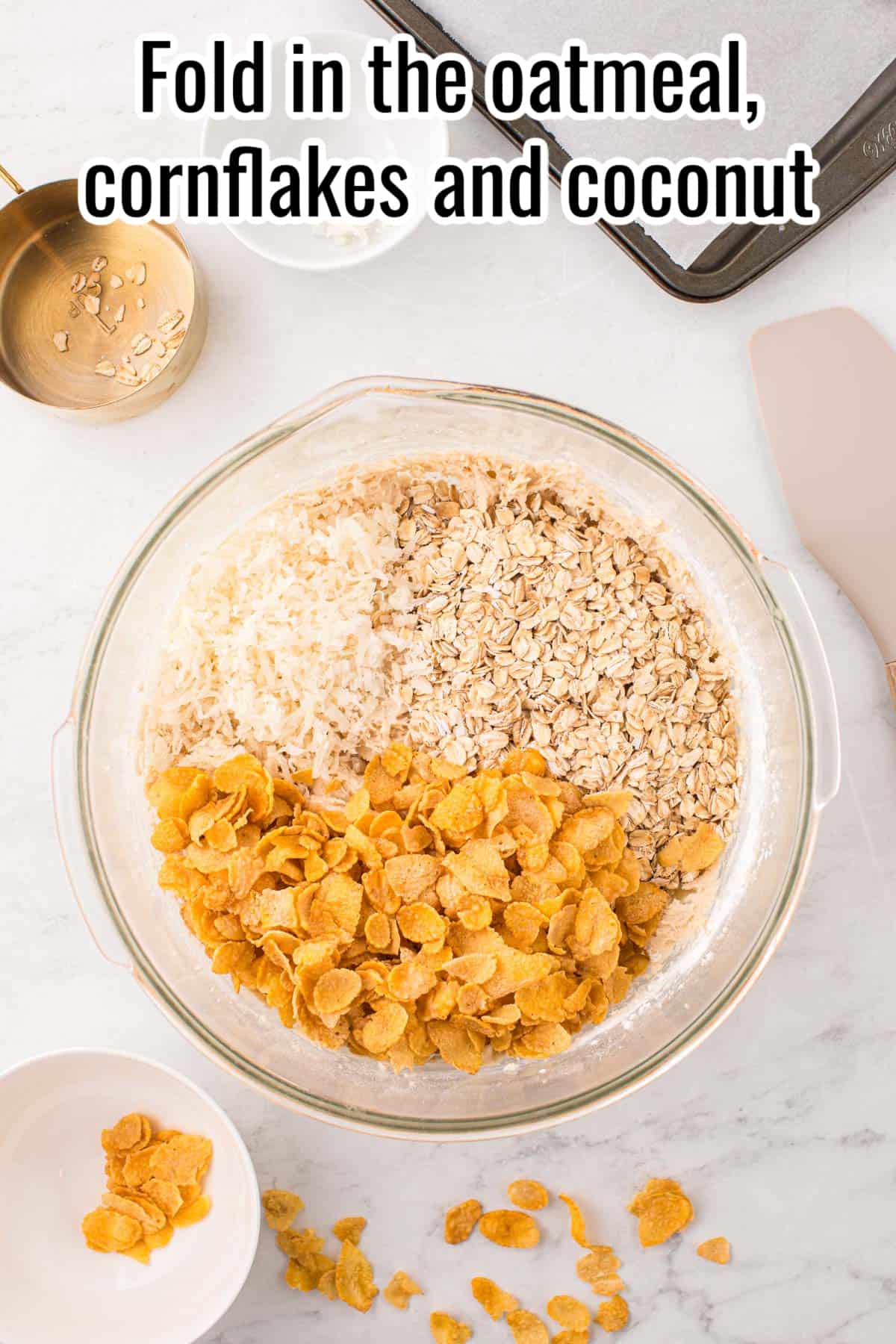 glass bowl with coconut, cornflakes and oats.