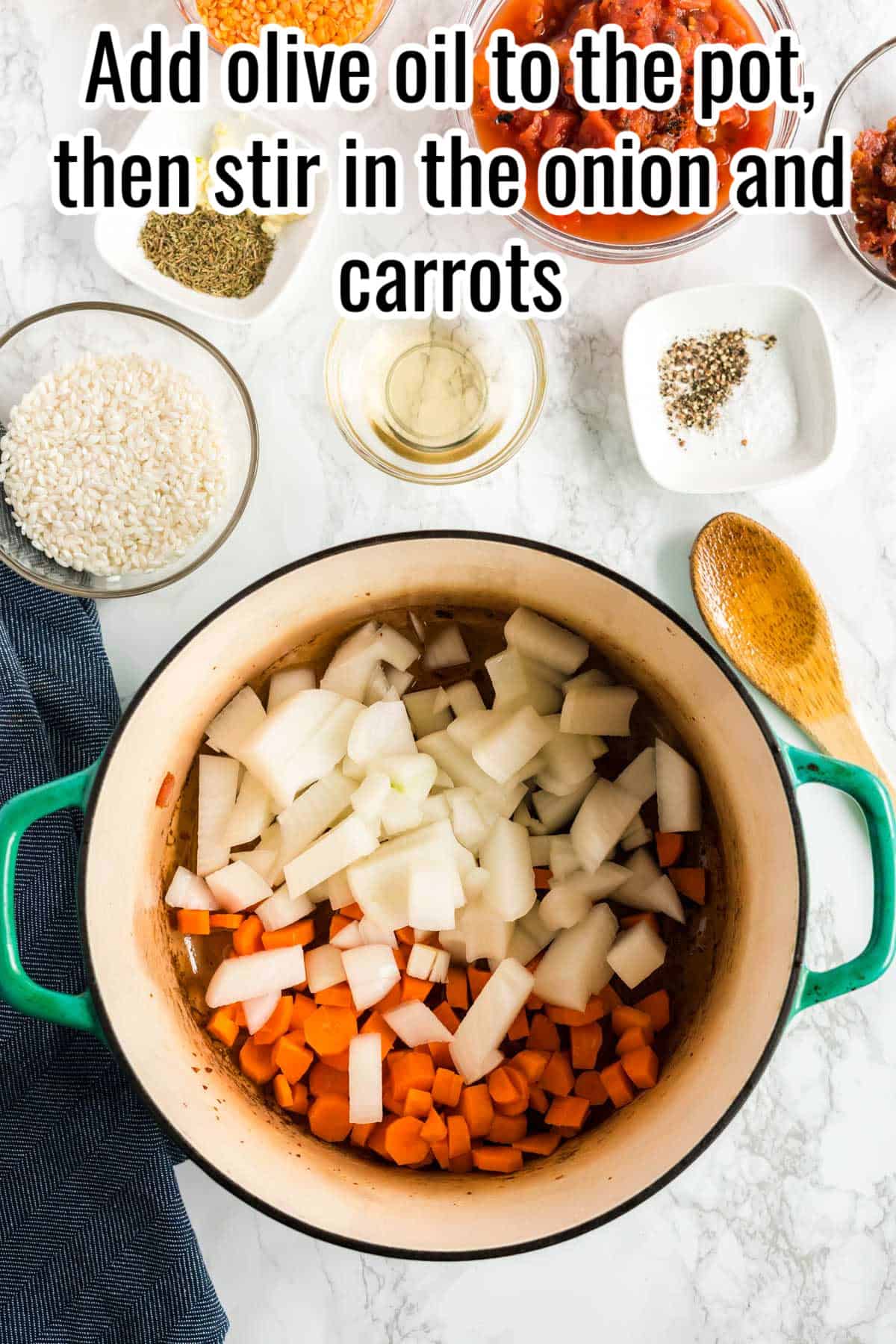 Chopped onions and carrots in a pot, text on the image says "Add olive oil to the pot, then stir in the onion and carrots."