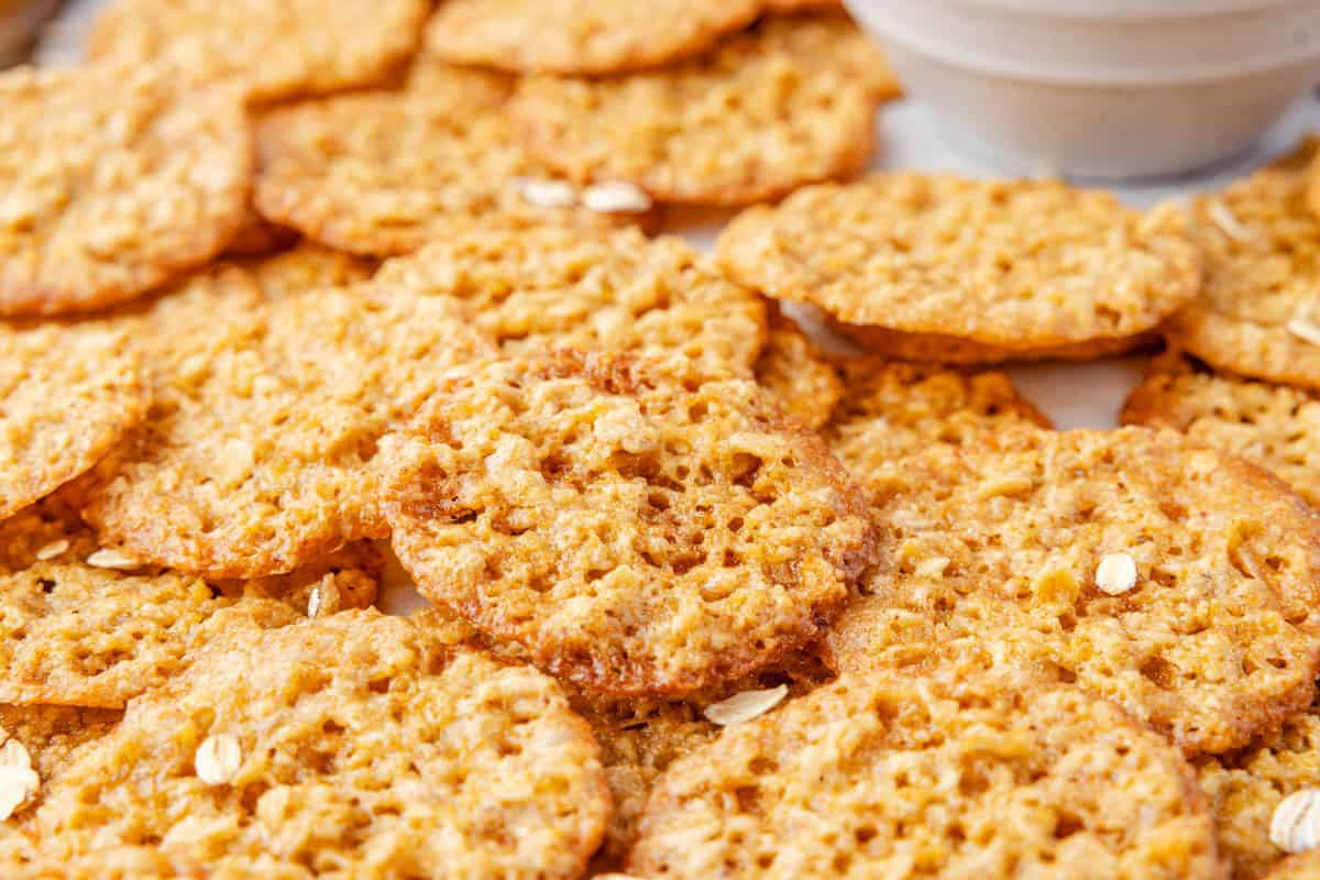 Close-up of several lace cookies with a crisp, lacy texture.