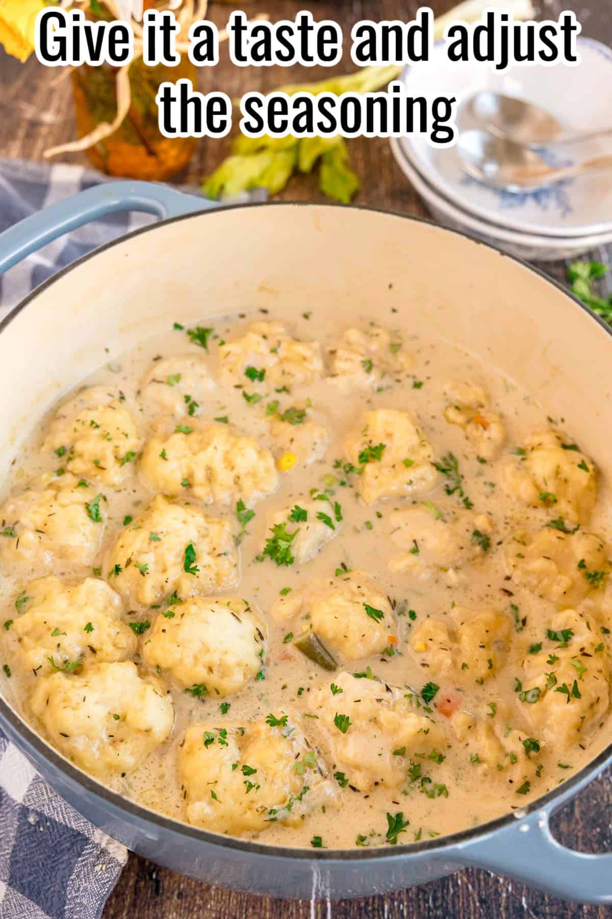 Finished chicken and dumplings in a pot, ready to serve. Text on the image says 'Give it a taste and adjust the seasoning'.