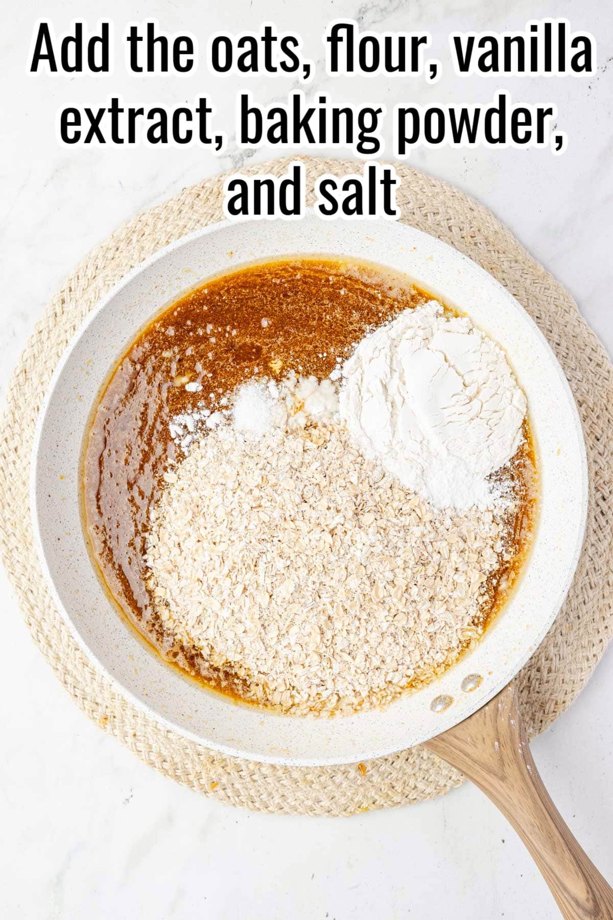 Oats, flour, and other dry ingredients added to the skillet. Text on the image says 'Add the oats, flour, vanilla extract, baking powder, and salt'.