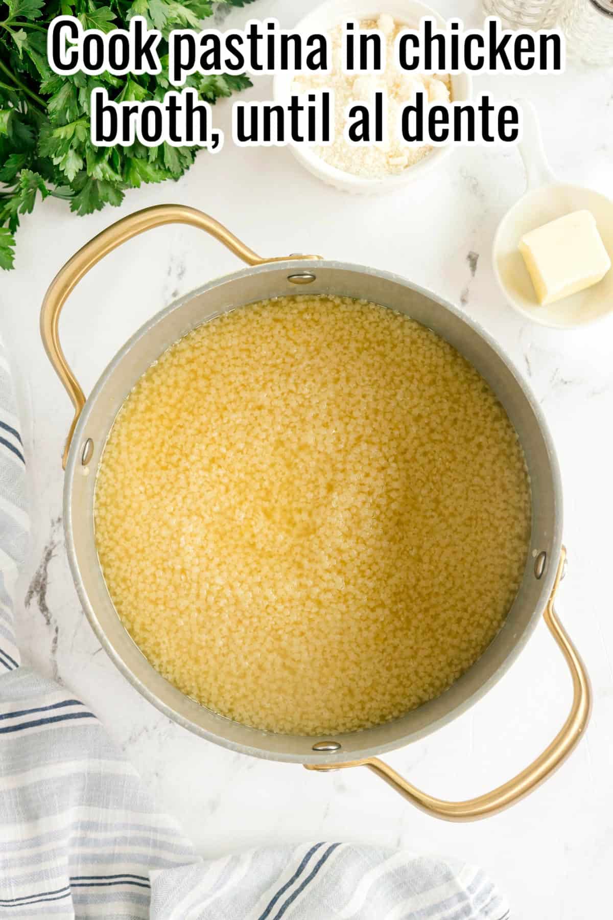 Pot filled with pastina and broth. Parmesan and butter in small bowls nearby. Text on the image says 'Cook pastina in chicken broth, until al dente'.