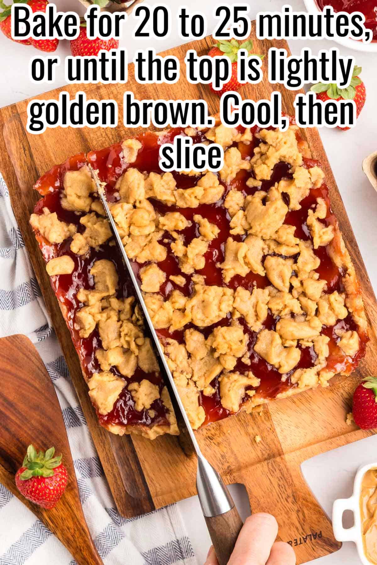 A knife slicing into a baked peanut butter jam bar slab on a wooden board. Text on the image says 'Bake for 20 to 25 minutes, or until the top is lightly golden brown. Cool, then slice'.