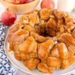 Close view of caramel-coated monkey bread with visible apple pieces.