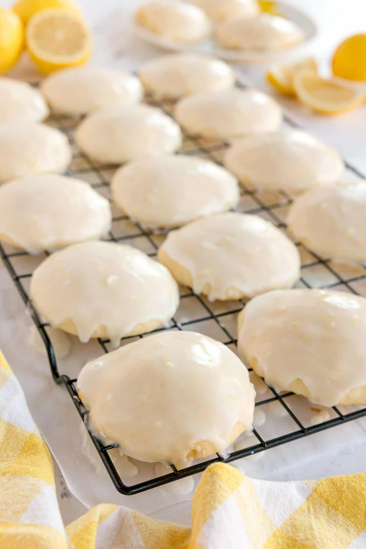 Rows of glazed lemon cookies on a cooling rack.