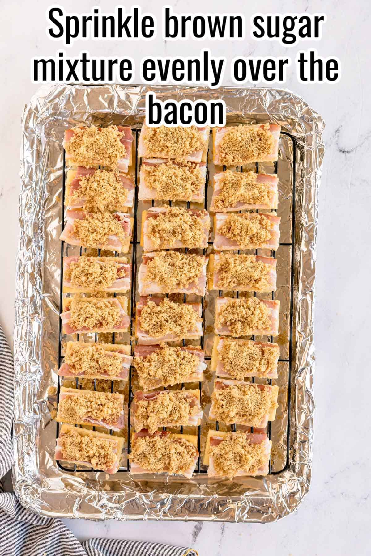 Brown sugar mixture sprinkled over bacon-topped crackers. Text on the image says 'Sprinkle brown sugar mixture evenly over the bacon'.