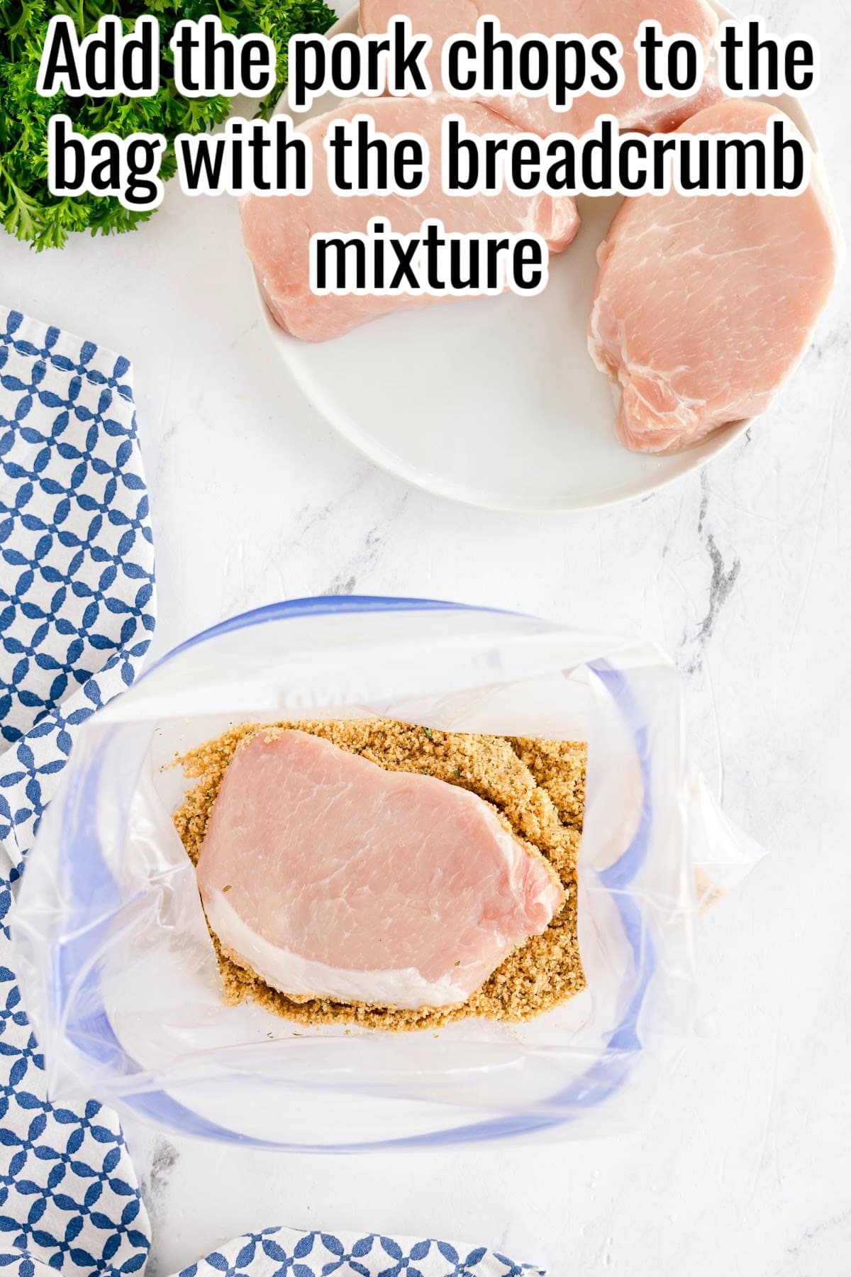 A raw pork chop in a bag with seasoned breadcrumbs. Text on the image says 'Add the pork chops to the bag with the breadcrumb mixture'.