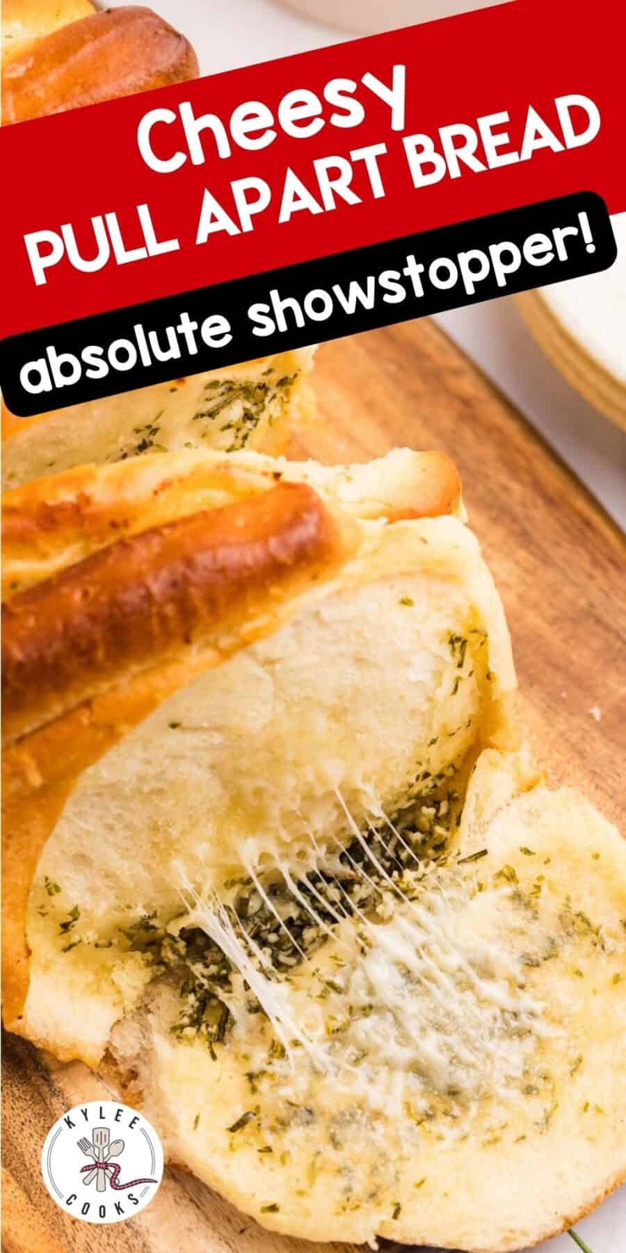 Closeup of a cheesy bread slice being pulled with melted cheese. Text on the image says 'Cheesy PULL APART BREAD absolute showstopper!' and 'KYLEE COOKS'.