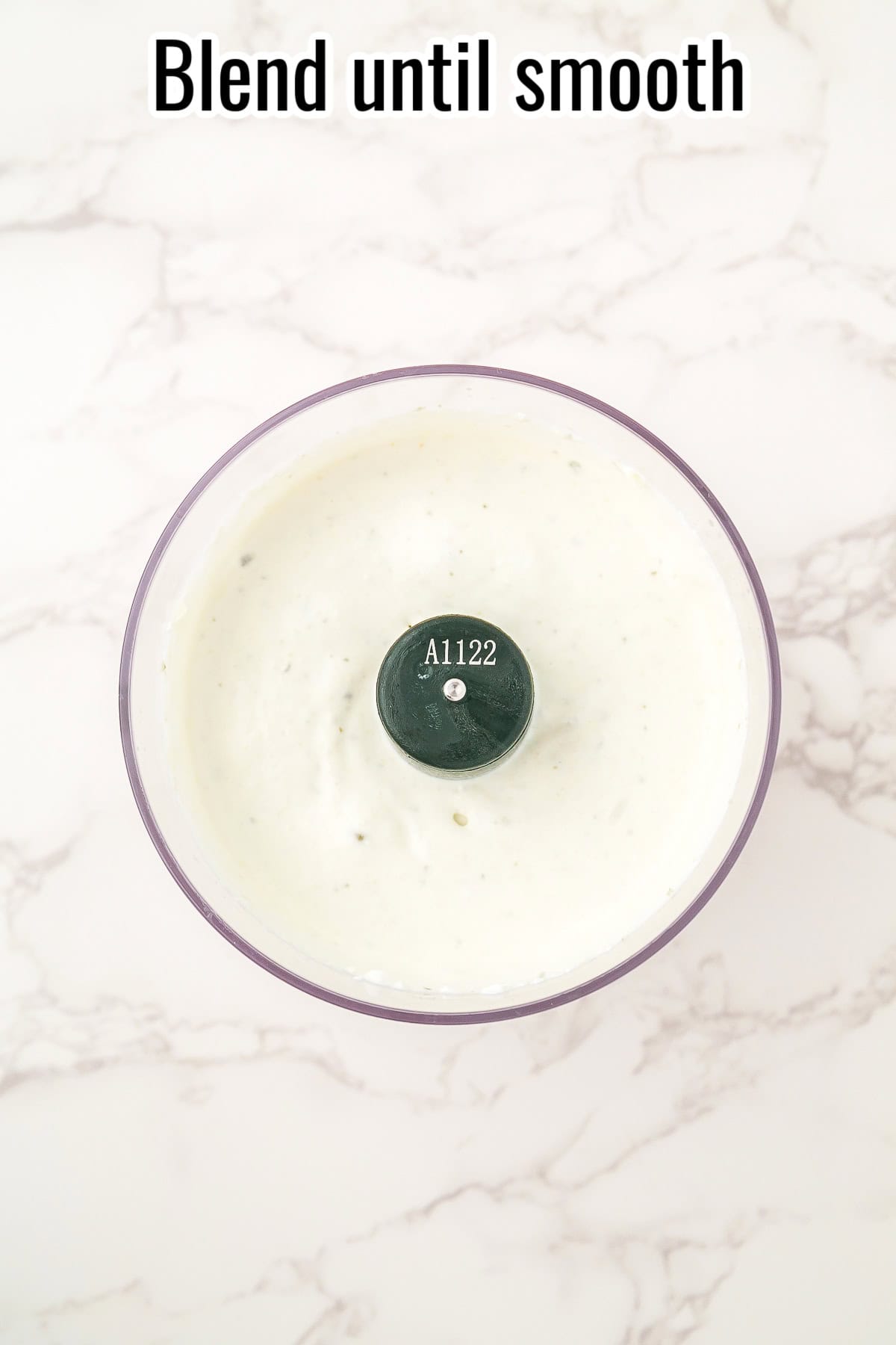 Blended creamy dip in a food processor. Text on the image says 'Blend until smooth'.