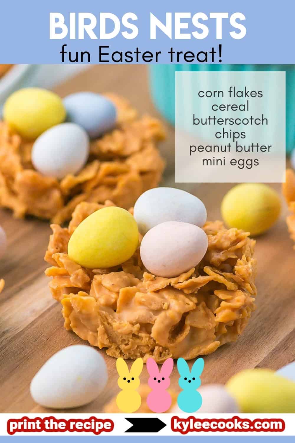 Bird’s nest cookie with pastel candy eggs on a wooden board. Text on the image says 'BIRDS NESTS fun Easter treat! corn flakes cereal butterscotch chips peanut butter mini eggs print the recipe kyleecooks.com'.