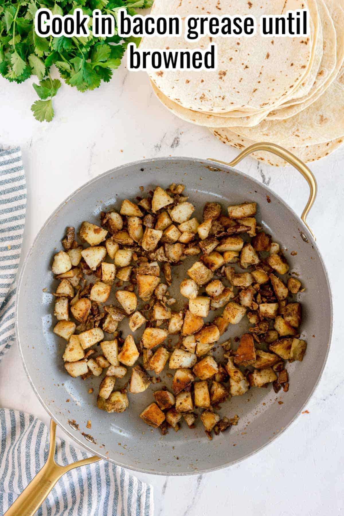 Diced potatoes browning in a skillet with text overlay “Cook in bacon grease until browned.”