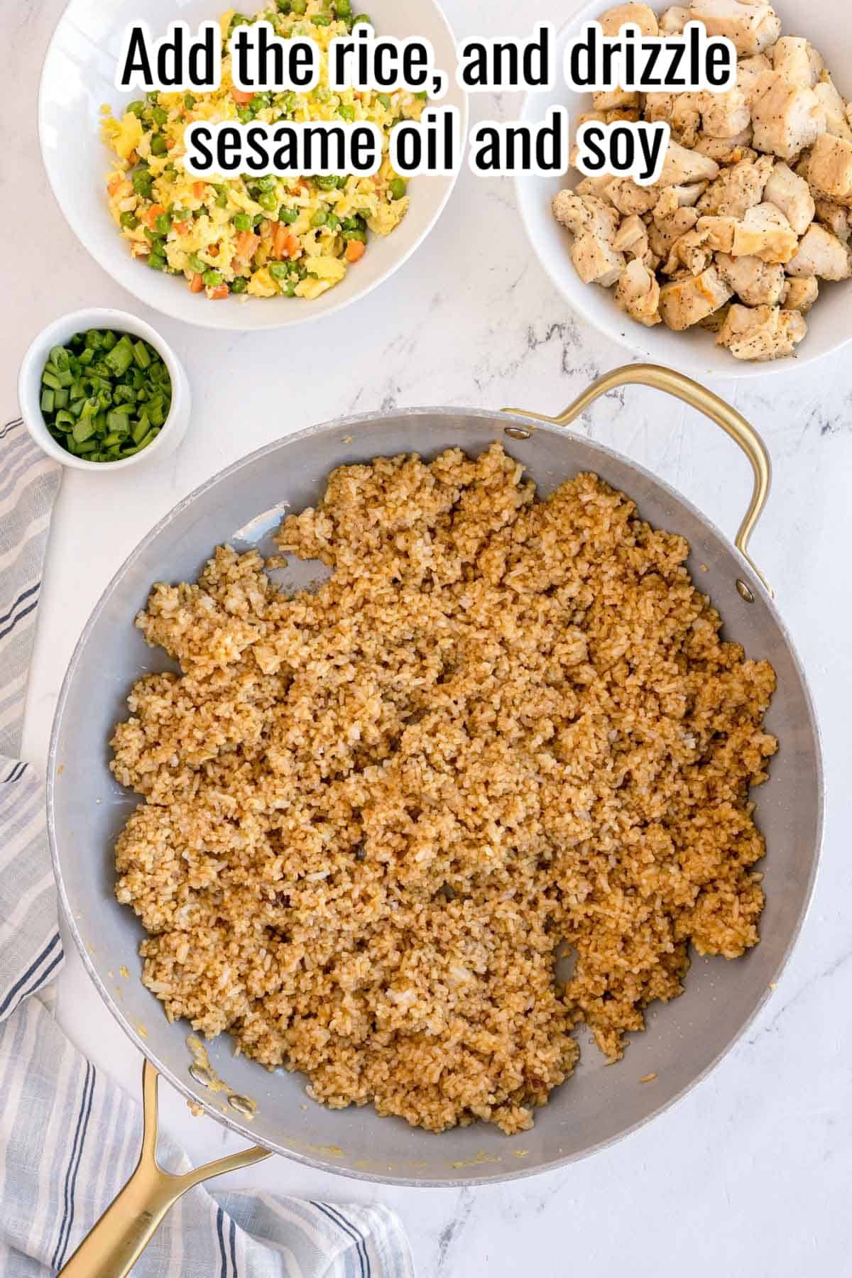 Rice cooking in a skillet with bowls of chicken and eggs nearby. Text on the image says 'Add the rice, and drizzle sesame oil and soy'.