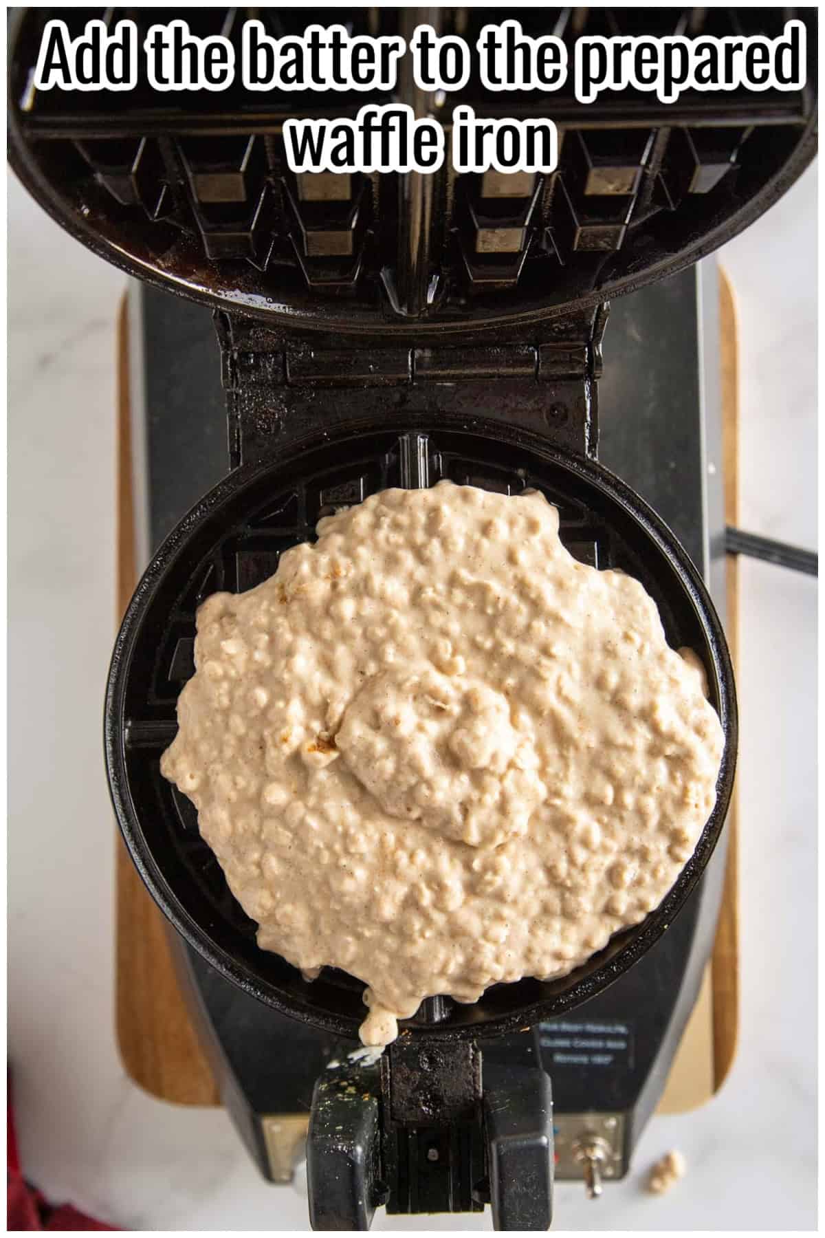 Waffle batter spread on a waffle iron. Text on the image says 'Add the batter to the prepared waffle iron'.