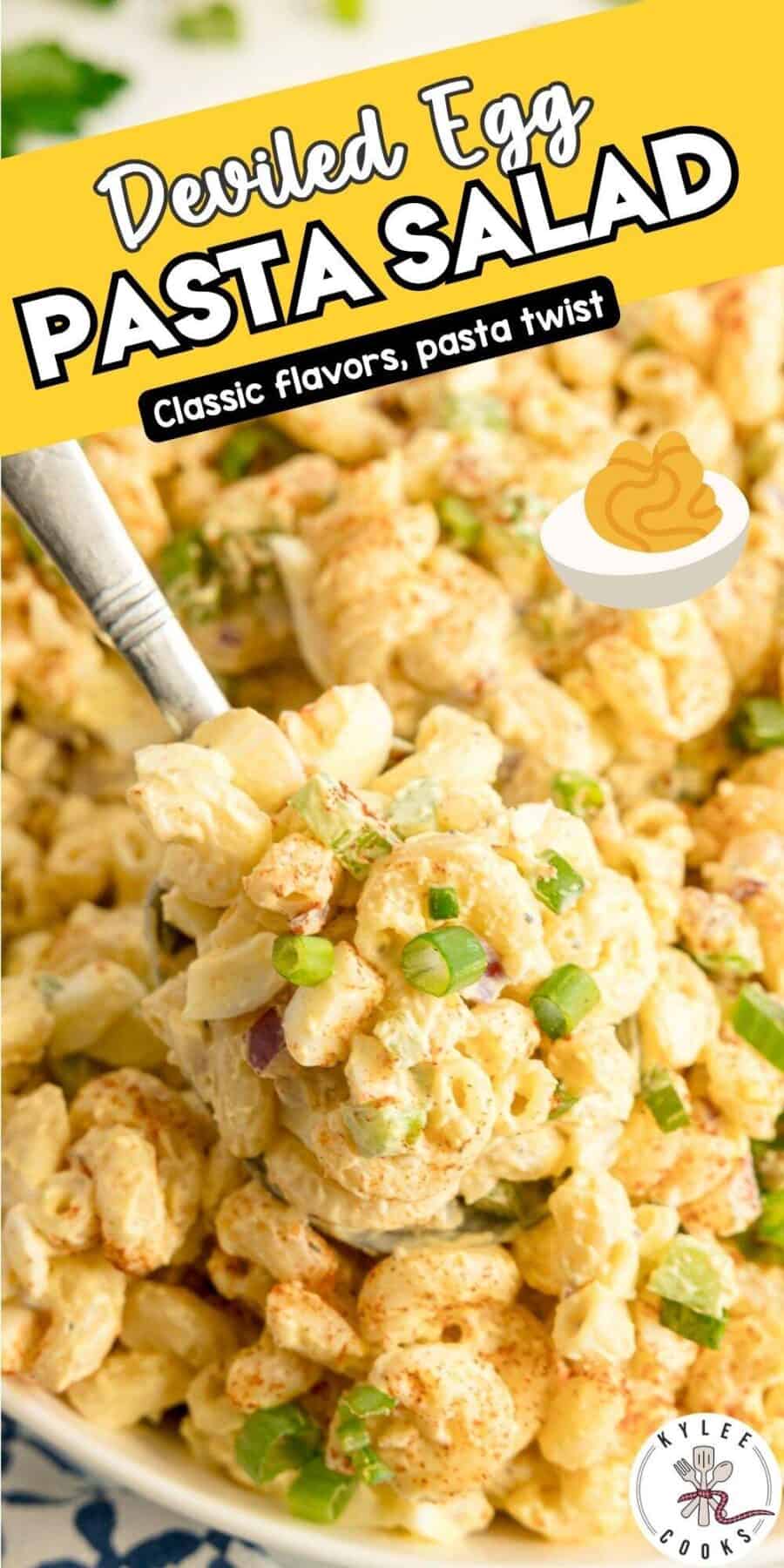 A close-up of deviled egg pasta salad with elbow macaroni, chopped green onions, and sprinkled paprika, served on a spoon.