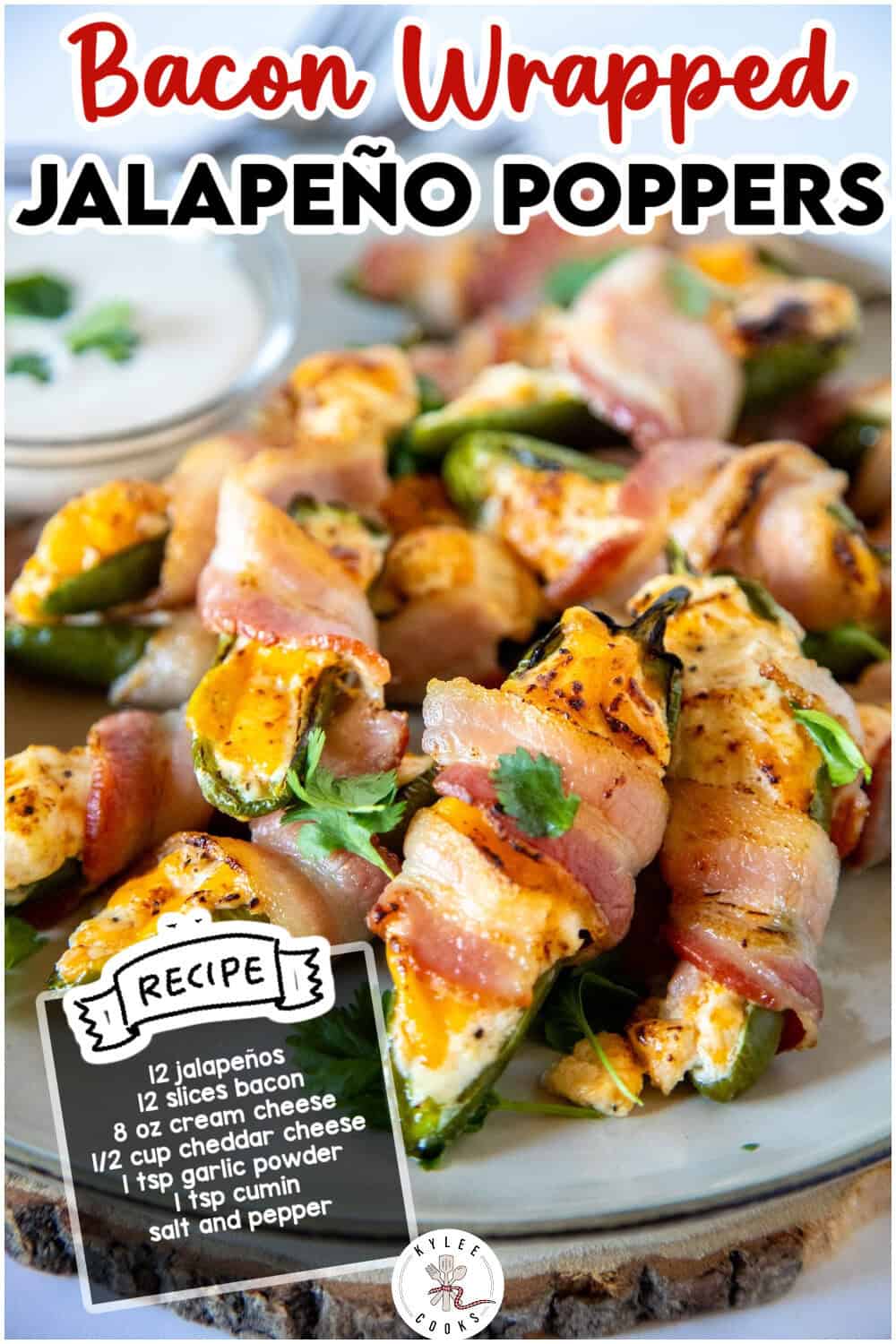A plate of bacon-wrapped jalapeño poppers filled with cream cheese, topped with herbs, with a recipe card listing ingredients in the foreground.