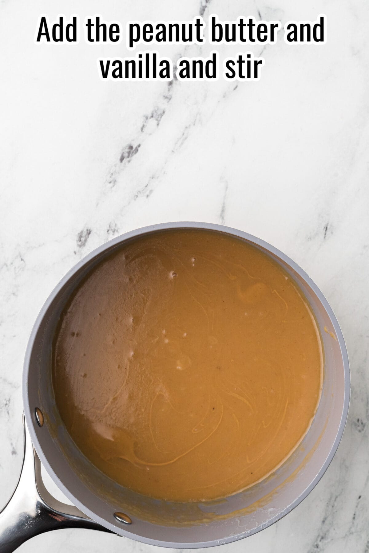 A saucepan filled with a smooth brown mixture sits on a marble surface. Text at the top reads, "Add the peanut butter and vanilla and stir.