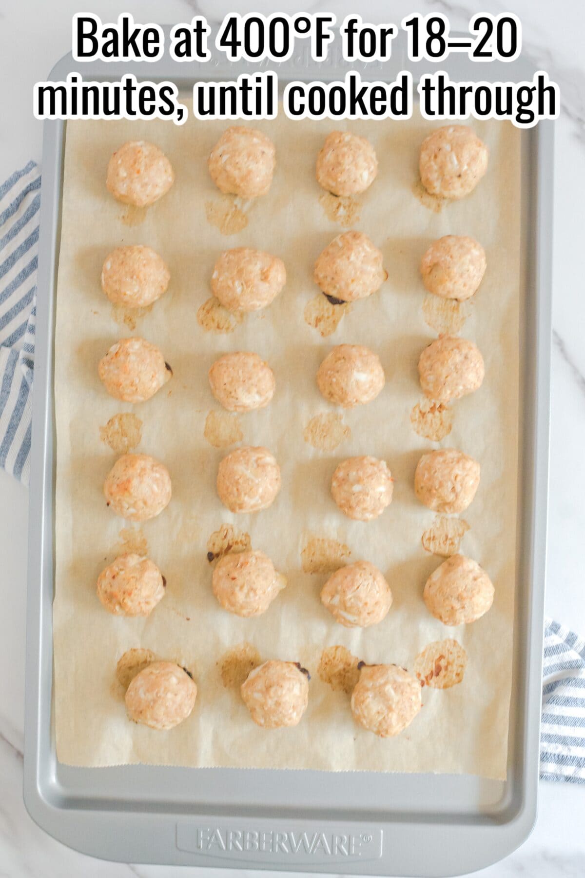 A baking sheet with parchment paper holds rows of uncooked meatballs. Text above instructs to bake at 400°F for 18-20 minutes, until cooked through.