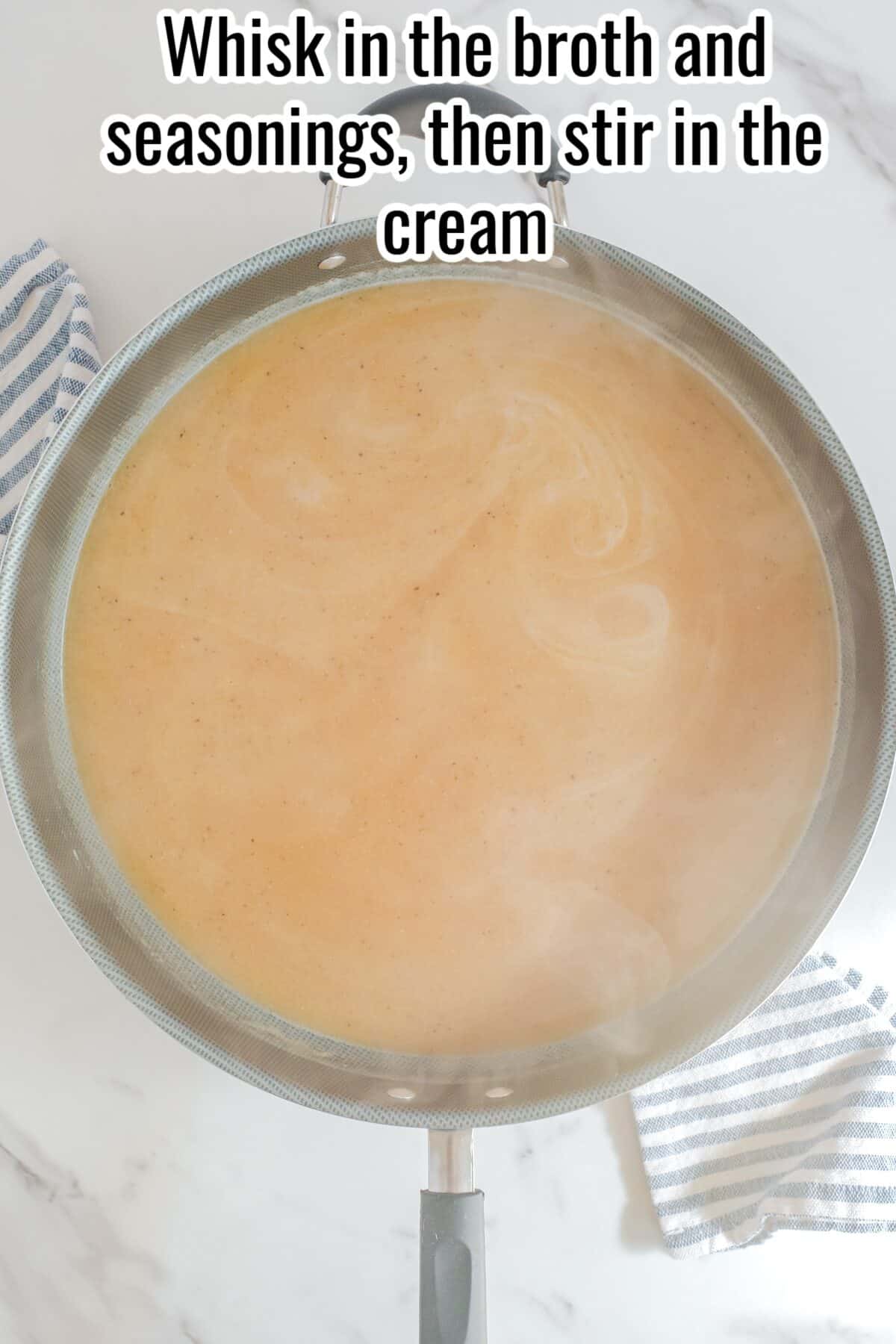 A skillet with a light brown sauce being stirred, surrounded by striped kitchen towels, with text instructing to whisk in broth, seasonings, and cream.