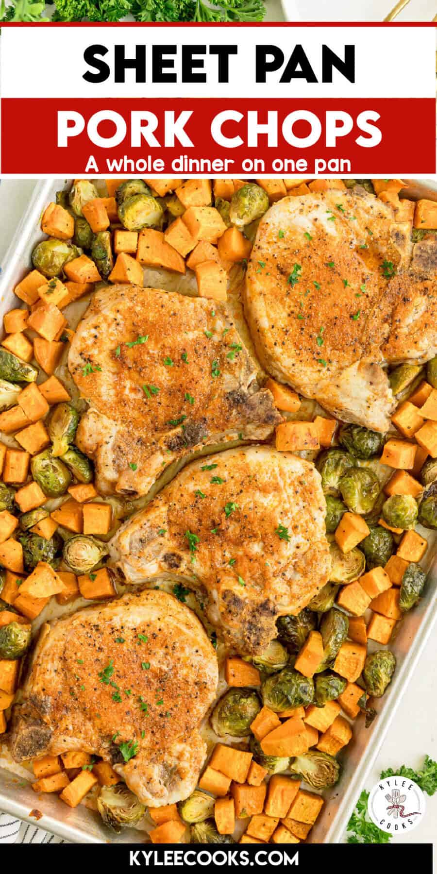 Sheet pan with baked pork chops, diced sweet potatoes, and Brussels sprouts, seasoned and garnished with herbs, shown on a cooking website.